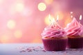 Birthday cupcakes with candles on bokeh background, closeup, Birthday cupcake with candles on pink background with bokeh, AI