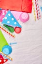 Birthday flat lay, top view and copy space for text, frame or background with colorful festival items, party hats and streamers Royalty Free Stock Photo