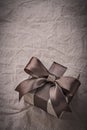 Birthday giftbox with brown tape on wrapping paper Royalty Free Stock Photo