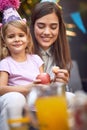 Birthday girl  celebrate birthday and  eating fruit with her mother Royalty Free Stock Photo