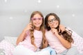 Birthday girl. Children posing with grimaces photo booth props. Pajamas party in bedroom. Friends cute and cheerful Royalty Free Stock Photo