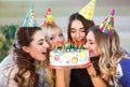 Birthday. Girls bite cake at a birthday party