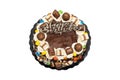 Birthday layer cake decorated with chocolate pieces with happy birthday text