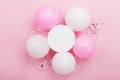 Birthday mockup with white paper list, confetti and pastel balloons on pink table top view. Flat lay composition. Royalty Free Stock Photo