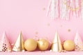 Birthday or party background with carnival cap, golden balloons and confetti. Festive greeting card Royalty Free Stock Photo