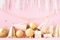 Birthday or party background with carnival cap, golden balloons, gift box and confetti. Festive greeting card Royalty Free Stock Photo