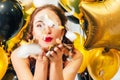 Birthday party balloons girl blowing confetti Royalty Free Stock Photo