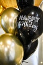 Birthday Party Balloons, golden and black balloons. The photo zone is decorated with black and yellow balloons . round golden Royalty Free Stock Photo