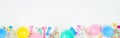 Birthday party banner with bottom border on a white background with balloons, party hats, streamers and confetti Royalty Free Stock Photo