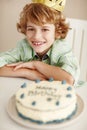 Birthday party, cake and boy in portrait with smile in family home for celebration, growth or milestone. Dessert Royalty Free Stock Photo