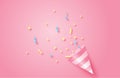Birthday party. Exploding pink popper cone with confetti. Event celebration concept