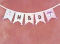 Birthday party flag design idea, design fabric party flag on pink texture background Royalty Free Stock Photo