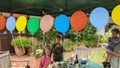 A birthday party in the garden with felt balloons on a string