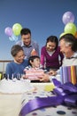 Birthday party, multi-generation family, opening presents Royalty Free Stock Photo