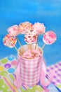 Birthday party table with pink marshmallow pops for kids