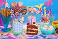 Birthday party table with torte and sweets for kids