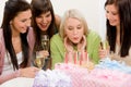 Birthday party - woman blowing candle on cake