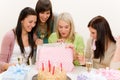 Birthday party - woman unwrap present, celebrating Royalty Free Stock Photo
