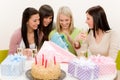 Birthday party - woman unwrap present, celebrating Royalty Free Stock Photo