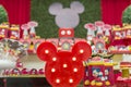 Birthday reception. Sweet table decorated with Mickey Mouse theme