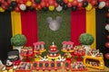 Birthday reception. Sweet table decorated with Mickey Mouse theme