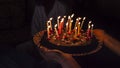 Birthday surprise cake with candles in darkness Royalty Free Stock Photo