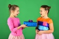 Birthday surprise concept. Girls with excited faces pose with presents