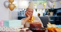 Birthday, thinking and sad senior woman with depression, grief and lonely in her home. Cake, face and elderly African Royalty Free Stock Photo