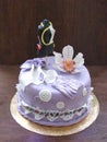 A birthday violet cake fondant with sugar mannequin and sugar orchid