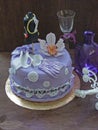 A birthday violet cake fondant with sugar mannequin, edible lace and sugar orchid