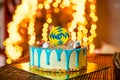 Birthday white cake with sweets and candle for little baby boy and decorations for cake smash Royalty Free Stock Photo