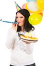 Birthday woman blowing into party horn blower Royalty Free Stock Photo