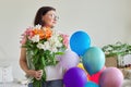 Birthday, 45 years old, happy female with bouquet of flowers and balloons Royalty Free Stock Photo