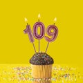 Birthday on a yellow background - Number 109 candle Royalty Free Stock Photo