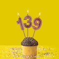 Birthday on a yellow background - Number 139 candle Royalty Free Stock Photo