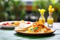 biryani on a banana leaf plate with papadum beside