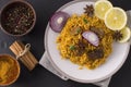 Biryani with chicken. Traditional Indian dish of rice and chicken, with spices and lemon. Royalty Free Stock Photo