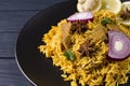 Biryani with chicken. Traditional Indian dish of rice and chicken, with spices and lemon. Royalty Free Stock Photo