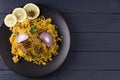 Biryani with chicken. Traditional Indian dish of rice and chicken, with spices and lemon. Royalty Free Stock Photo