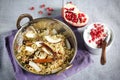 Biryani indian rice dish with coconut and pommegranate raita