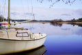 Biscarrosse harbor in lake with small boat sailboat in blue water reflection in landes france