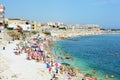 BISCEGLIE, ITALY - AUGUST 3, 2017: Very Crowded Beach Full Of People At The Mediterranean Sea in Apulia turist region, Bisceglie Royalty Free Stock Photo