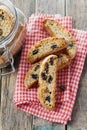 Biscotti or cantucci with raisins on wooden rustic table, traditional Italian biscuit or cookie