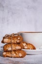 Biscotti Cantuccini Cookie Biscuits with Almonds Shortbread. White cup of coffee and traditional homemade italian Royalty Free Stock Photo