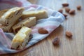 Biscotti cookies and almonds on wooden background