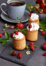 Biscuit cakes filled with wrapped cream and strawberries