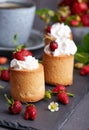 Biscuit cakes filled with wrapped cream and strawberries