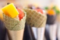 Biscuit cones filled with salted cream mixed with vegetables