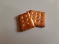 Biscuit .Half a biscuit on a biscuit on a white ladie.? Royalty Free Stock Photo