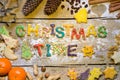Biscuit letters and christmas decoration on wood, christmastime Royalty Free Stock Photo